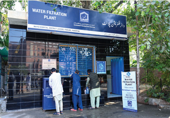 Residents collecting clean drinking water from an Alkhidmat water filtration plant at Mayo Hospital in Lahore.