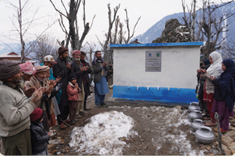 Residents drawing clean water from an Alkhidmat gravity flow scheme project in Azad Kashmir.